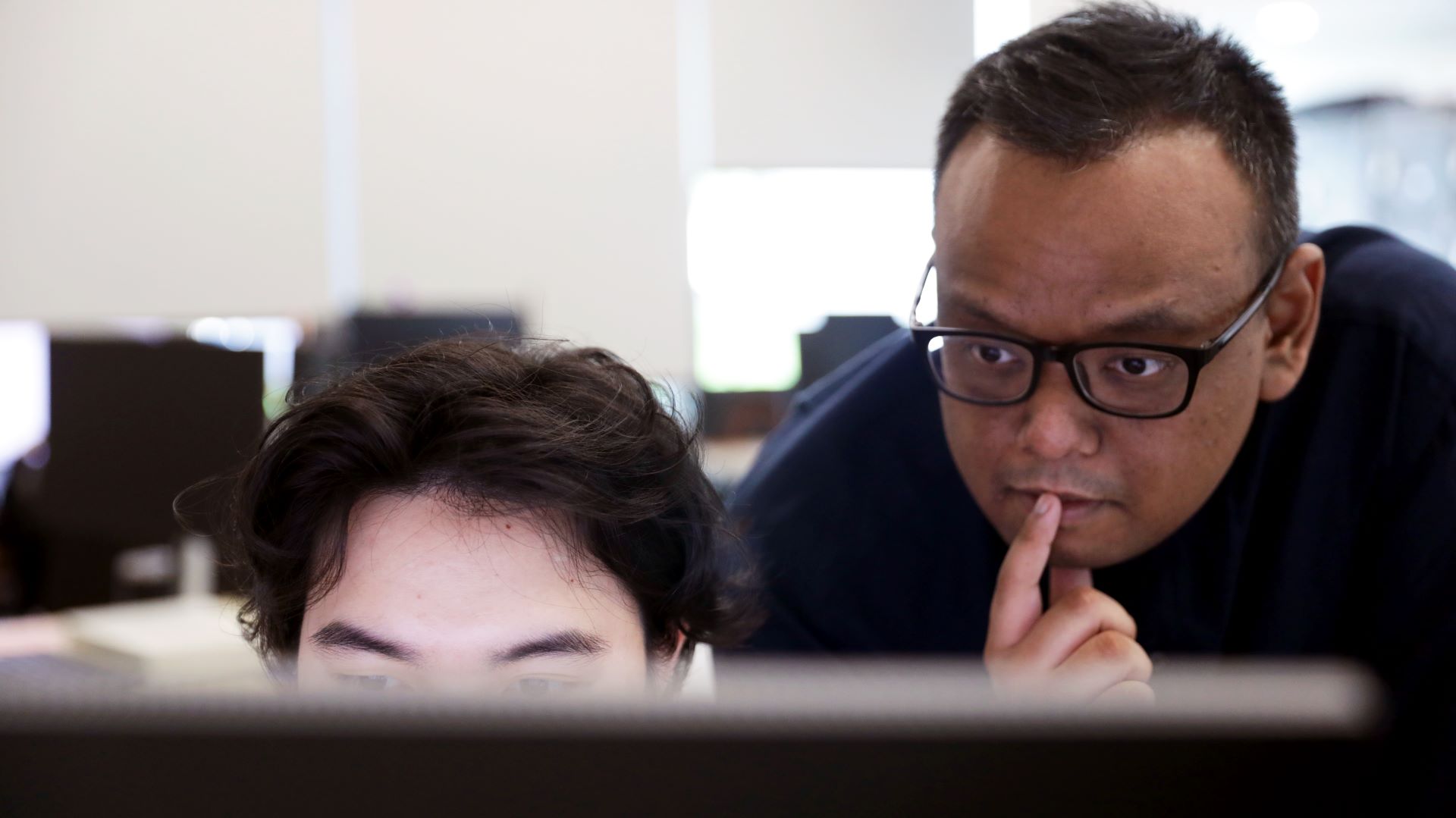 Zul, our IT whiz, expertly troubleshooting network connectivity for a colleague.