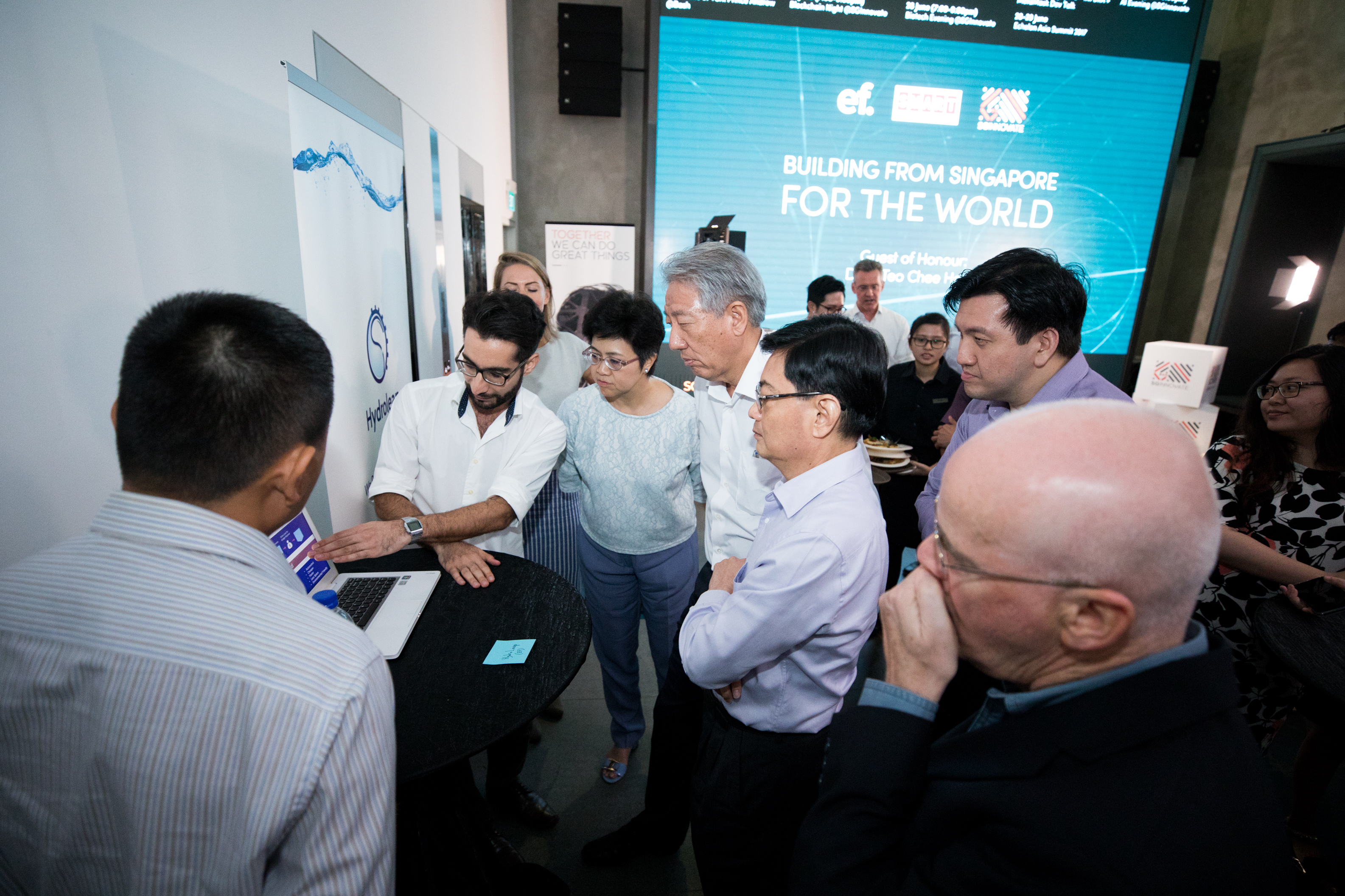 DPM Teo and Minister Heng listening to Mohammad